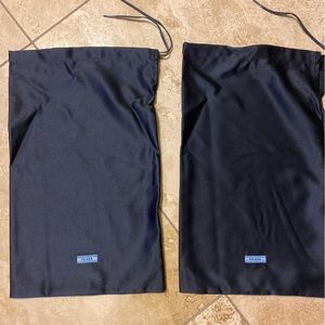Two Prada shoe dust covers